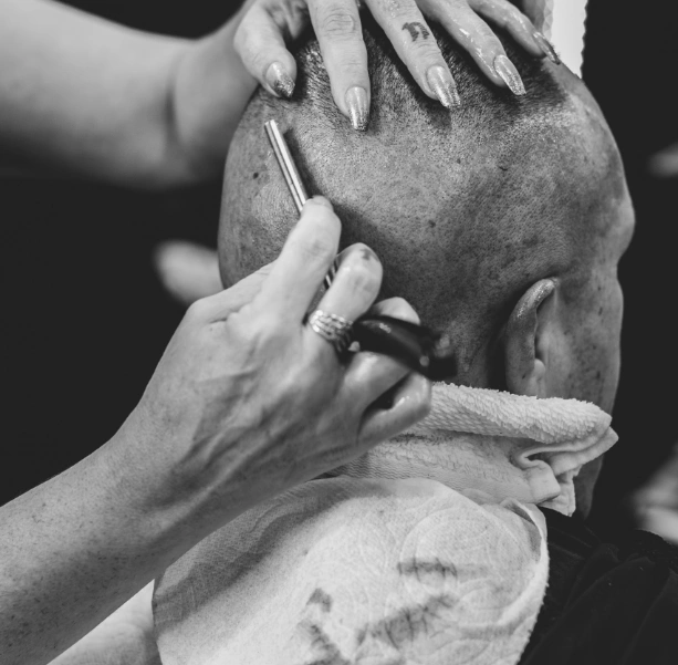 Hairdresser cutting hair